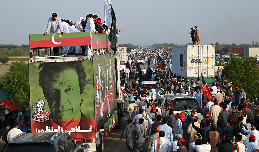 Supporters of Pakistan's former prime minister Imran Khan, take part in a protest rally in Attock on May 25, 2022. (AFP)