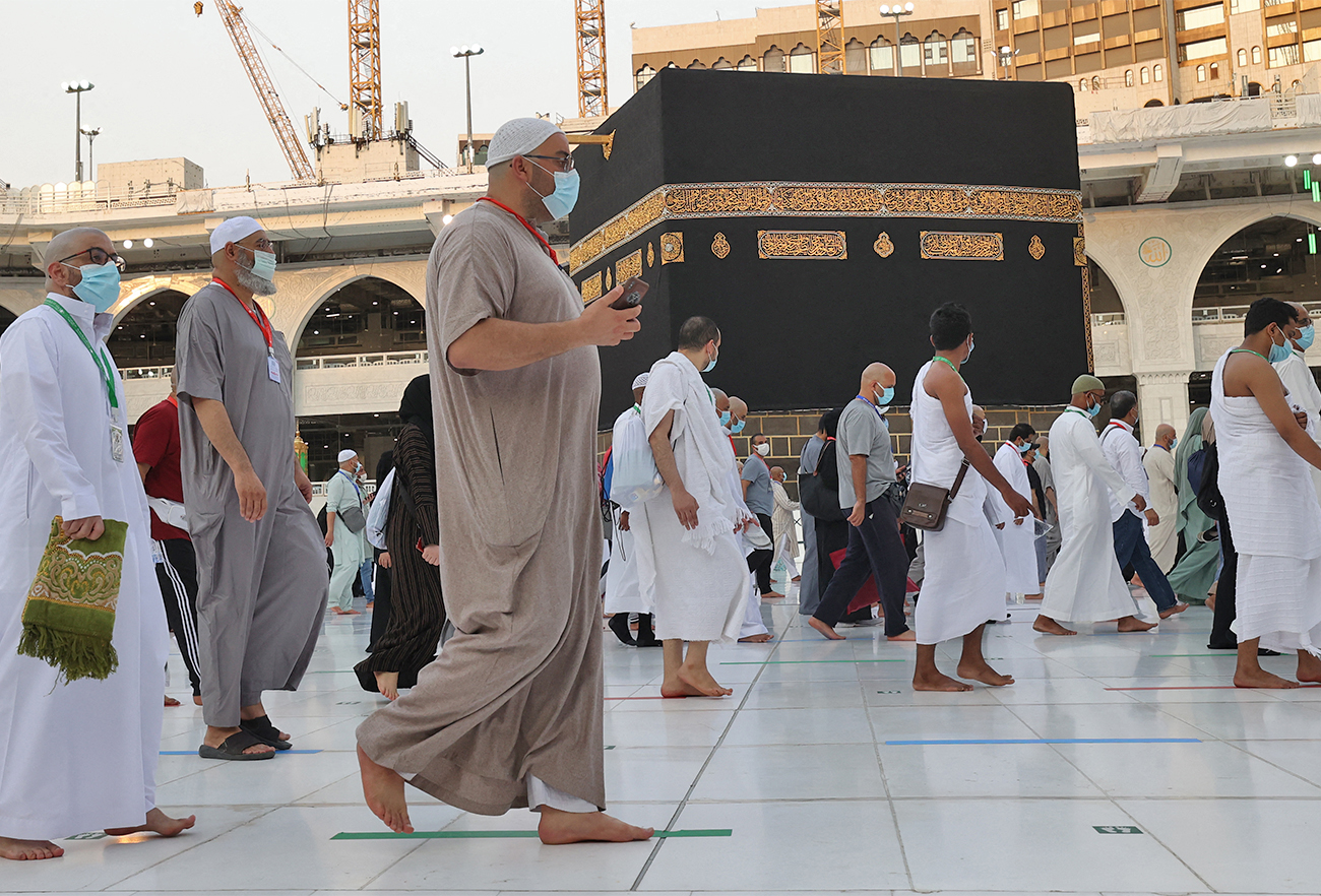Worshippers circumambulate the Kaaba, Islam's holiest shrine, at the Grand mosque in the holy Saudi city of Mecca, on the first day of the al-Adha feast celebrated by Muslims worldwide, on July 20, 2021. (AFP/File)