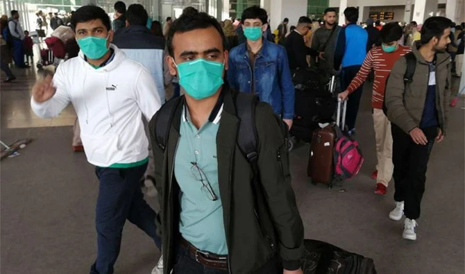 Pakistani students wearing protective facemasks upon their arrival from China at the Islamabad International Airport in Islamabad on February 3, 2020. (AFP/FILE)