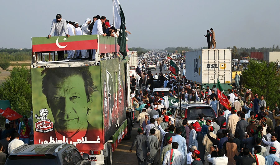 Supporters of Pakistan's former prime minister Imran Khan, take part in a protest rally in Attock on May 25, 2022. (AFP)