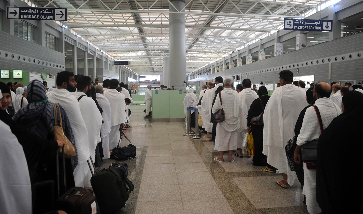 Pakistani Muslims wait to pass security as the first pilgrims for the annual Hajj pilgrimage arrive in Jeddah on July 24, 2017. (AFP/File)