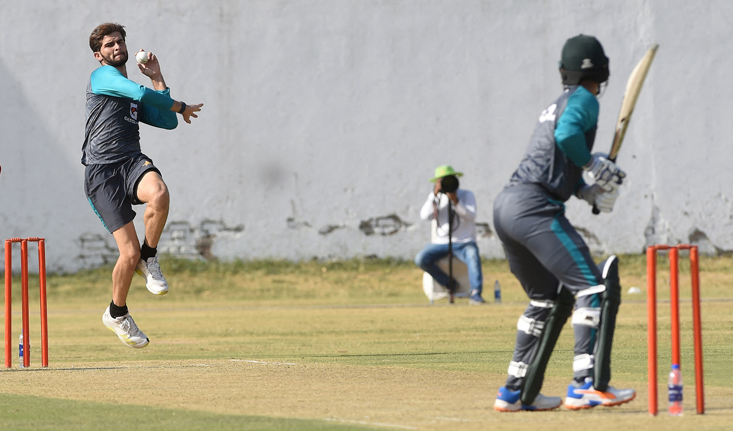 Pakistan's Shaheen Shah Afridi (L) delivers a ball during the practice session in Lahore on June 4, 2022, ahead of the West Indies cricket tour of Pakistan. (AFP)