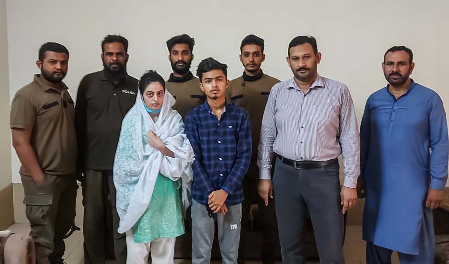 Dua Zehra, (3rd L), and her husband Zaheer Ahmed, center, are seen in the custody of the Punjab Police on June 5, 2022. (Photo courtesy: social media)