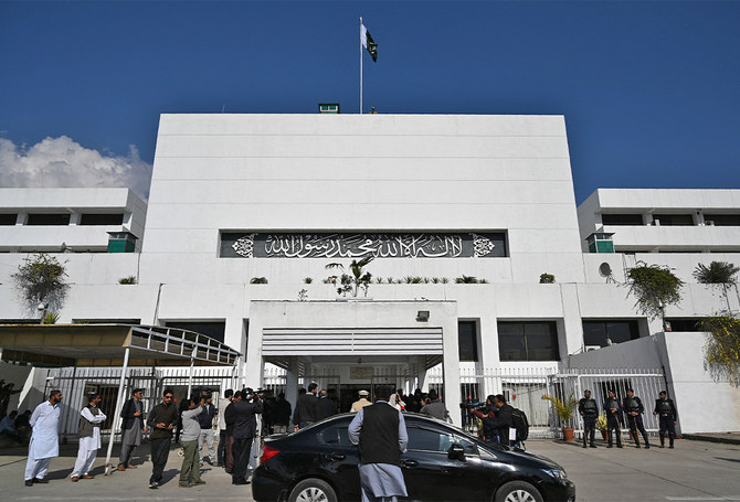 Pakistani media personnel gather outside the Parliament building during a joint session in Islamabad, Pakistan, on February 28, 2019. (AFP/File)