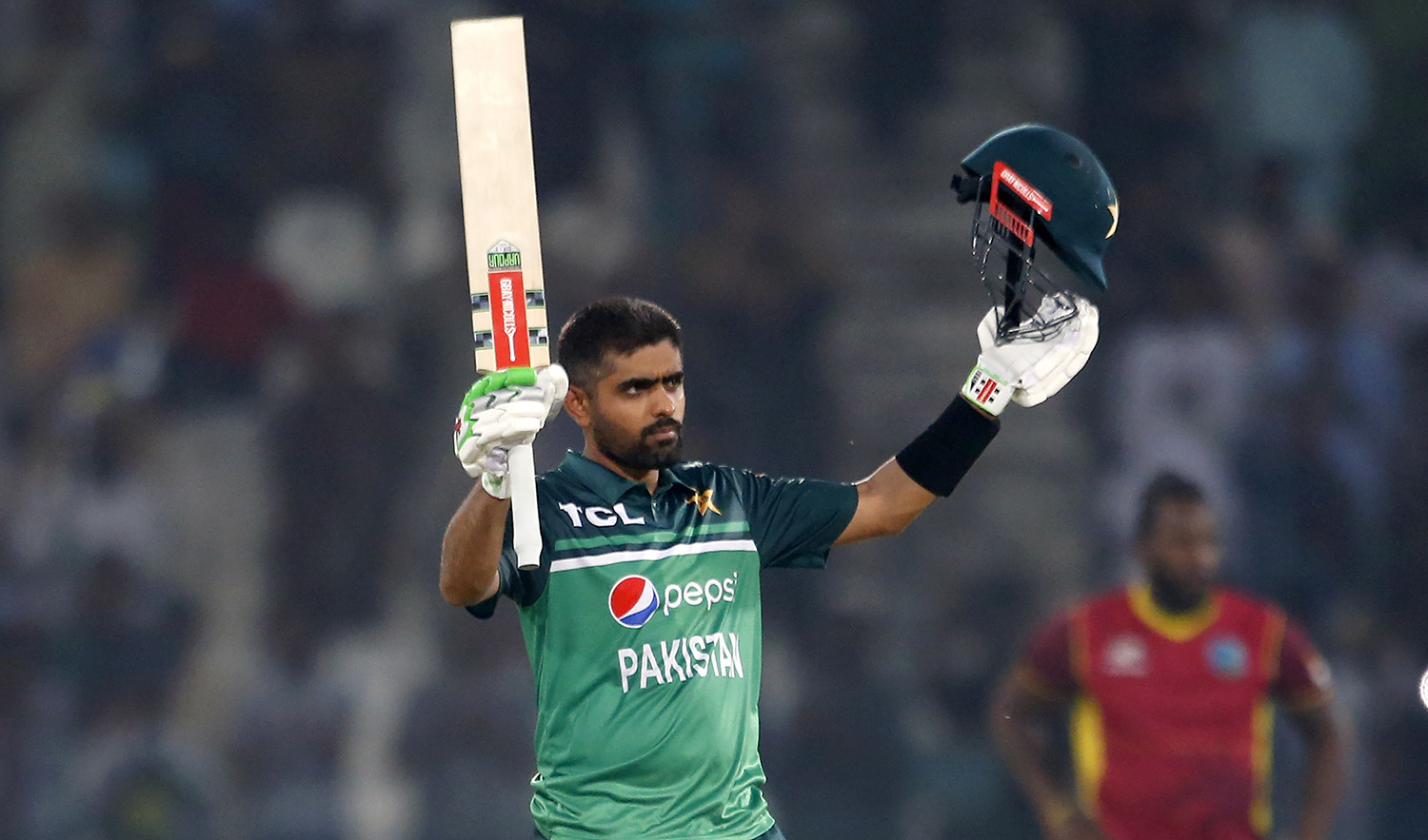 Pakistan's Babar Azam celebrates after scoring a century during the first ODI cricket match against West Indies at the Multan Cricket Stadium on June 8, 2022. (AP)