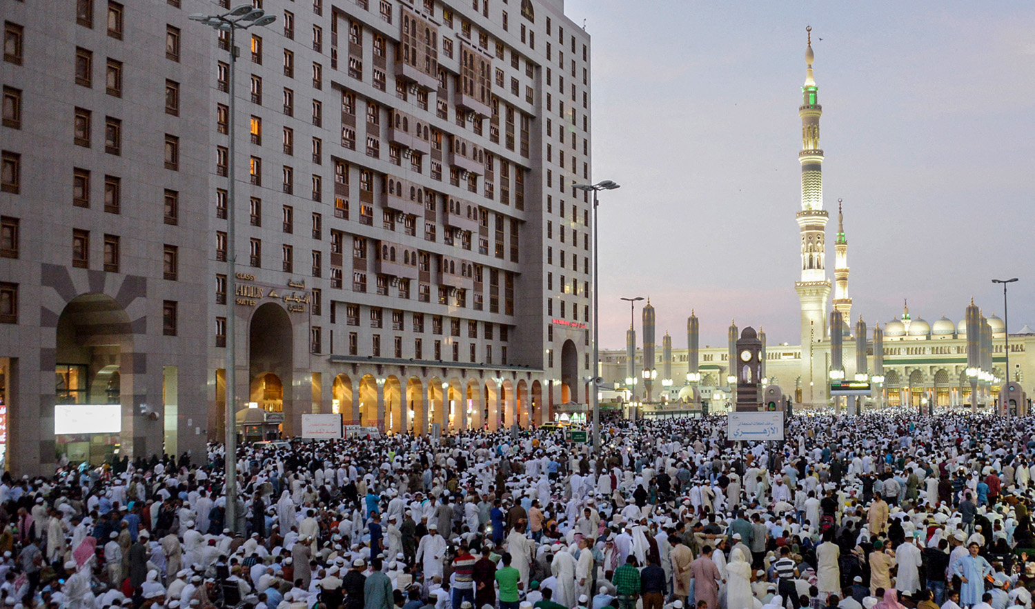 Muslim worshippers gather for Eid al-Fitr prayers at Al-Masjid Al-Nabawi in Madinah, Saudi Arabia on July 6, 2016. (AFP/File)
