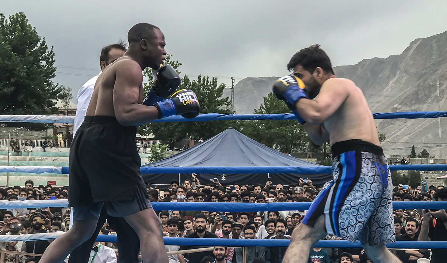 Representatives of Nigeria and Afghanistan fight at Lalik Jan Stadium in Gilgit, Pakistan, during a World Boxing Association’s Asia Welterweight Championship match on June 11, 2022. (AN photo)