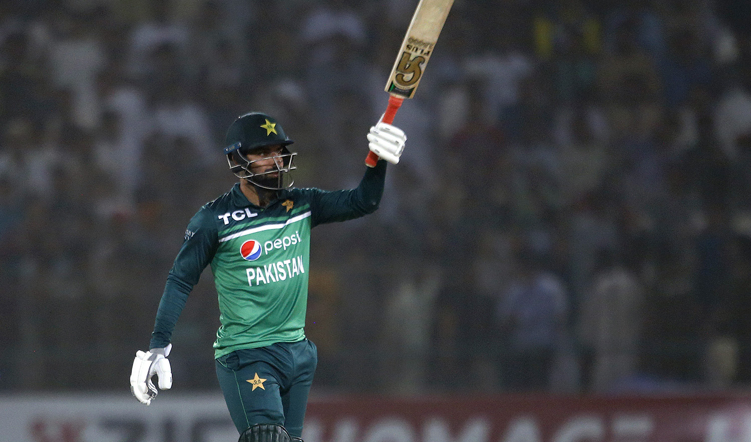Pakistan's Shadab Khan celebrates after scoring fifty during the third one day international cricket match against West Indies at the Multan Cricket Stadium, in Multan, Pakistan, on June 12, 2022. (AP)