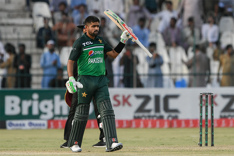 Pakistan's captain Babar Azam raises his bat after scoring a half-century during the second ODI cricket match between Pakistan and West Indies in Multan on June 10, 2022. (AFP)