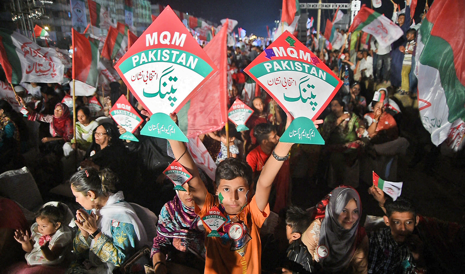 Supporters of the Pakistani political Muttahida Qaumi Movement (MQM) party attend an campaign meeting ahead of the general election in Karachi, on July 23, 2018. (AFP/File)