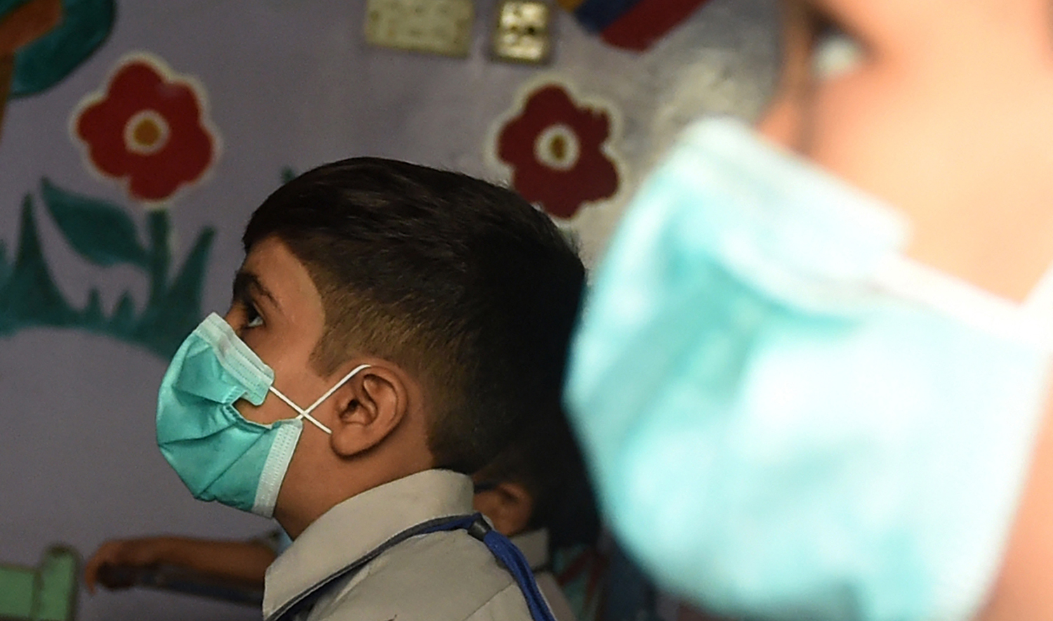 Students attend a class at a school wearing facemasks to protect themselves from the Covid-19 coronavirus in Karachi, Pakistan, on September 28, 2020. (AFP/File)
