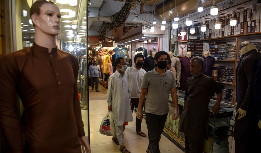 People visit a market in Karachi on May 13, 2020. (AFP/FILE)