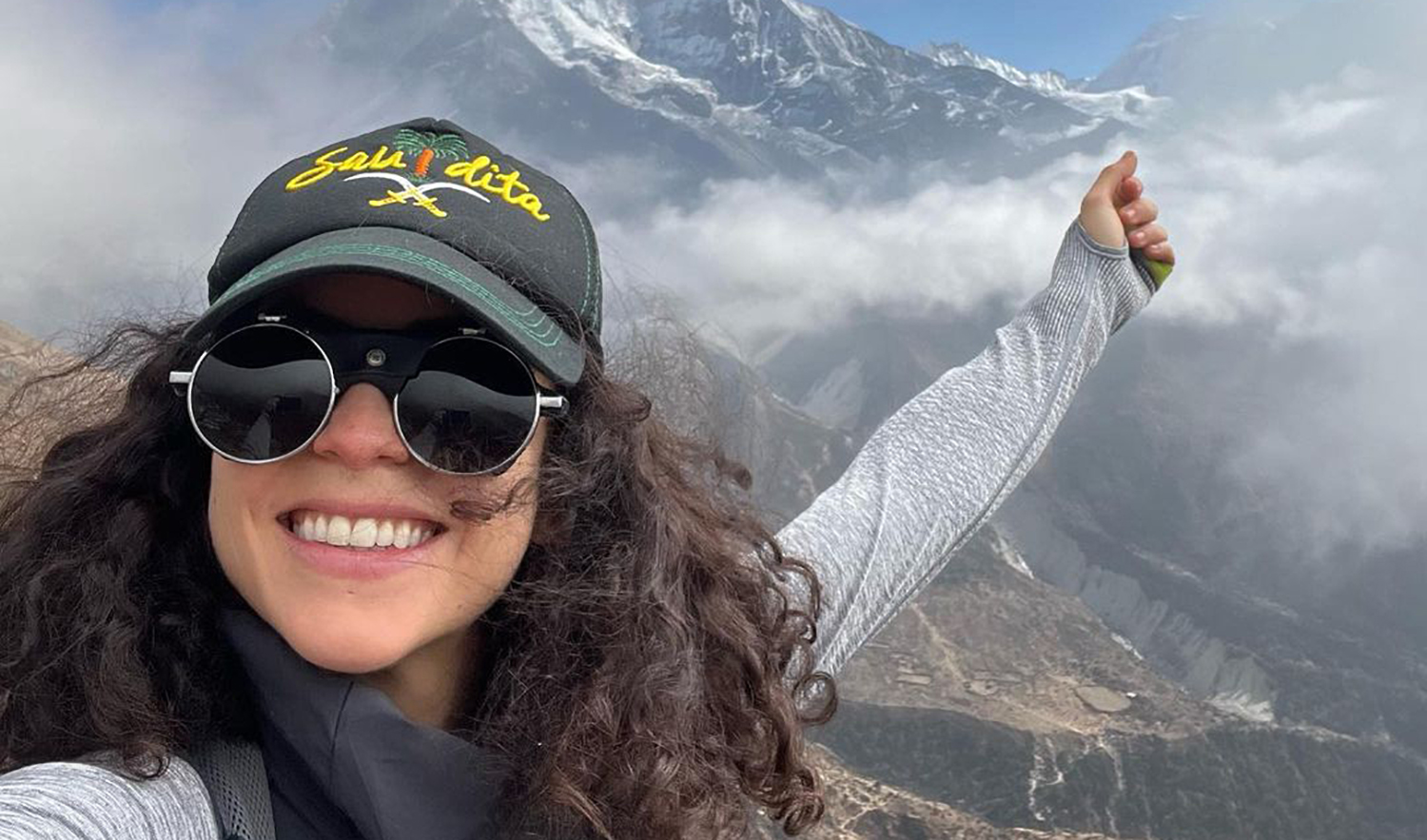 Lebanese mountaineer pose in front of Ama Dablam mountain in Nepal in this file photo shared on her Instagram on November 29, 2021. (Photo courtesy: @nellyattar/Instagram)