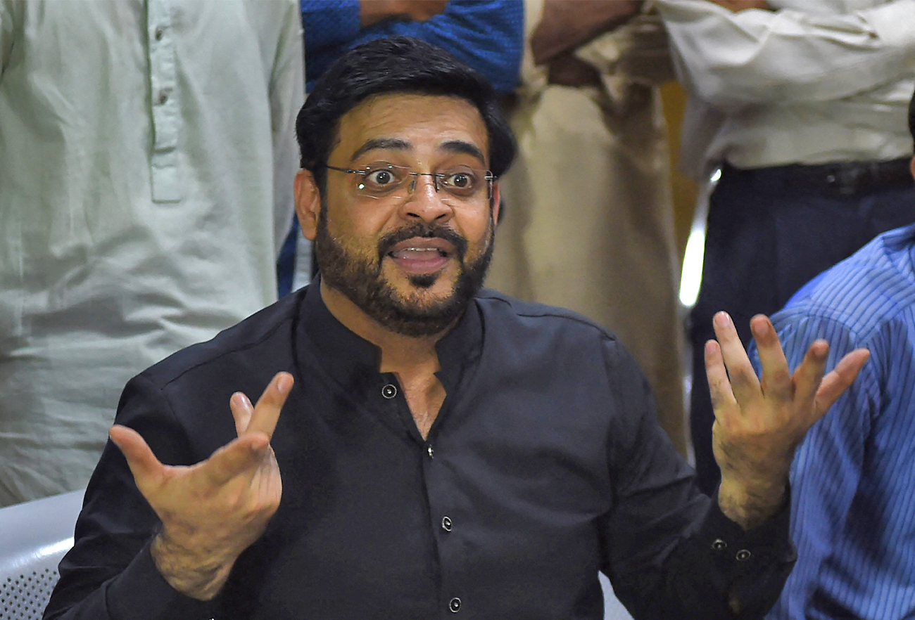 Aamir Liaquat Hussain, a televangelist, gestures as he speaks with students during an election campaign in Karachi, Pakistan, on July 11, 2018. (AFP/File)