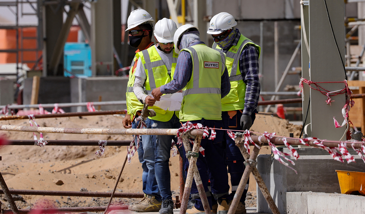 Workers are pictured next to a waste management facility under construction at the Bee'ah company in Sharjah, UAE, on September 2, 2021. (AFP/File)