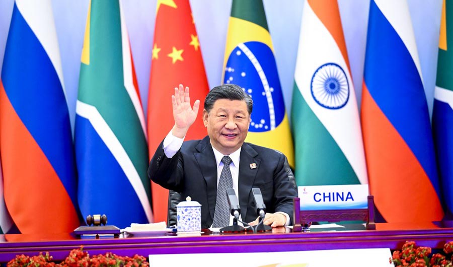Chinese President Xi Jinping waves while hosting the 14th BRICS Summit in Beijing on June 23, 2022. (@XHNews/Twitter)