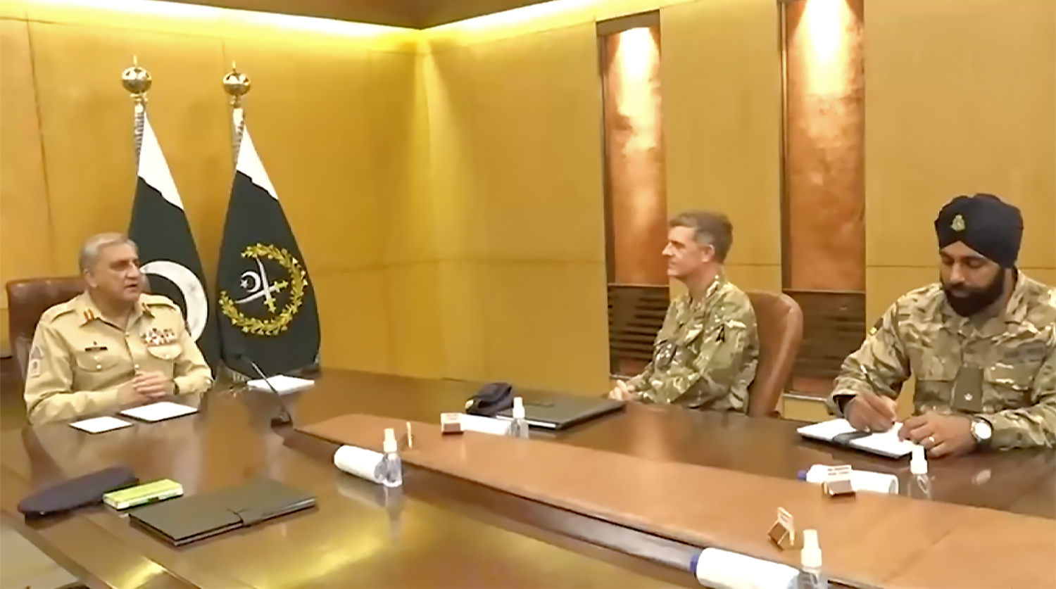 Pakistan's army chief General Qamar Javed Bajwa (left) meets a delegation of British Sikh soldiers in Rawalpindi, Pakistan on June 28, 2022. (Screengrab from a video shared by ISPR)