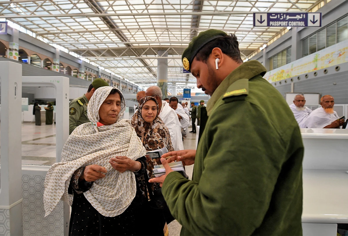 Muslim pilgrims go through passport control upon their arrival to King Abdulaziz International Airport in Jeddah on July 7, 2019, prior to the annual Hajj pilgrimage in the holy city of Mecca. (AFP/File)