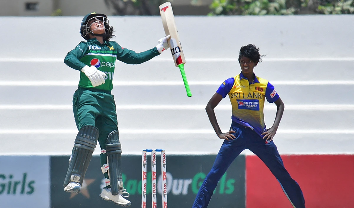 Pakistan's Sidra Amin (L) celebrates after scoring a century as Sri Lanka's Kaveesha Dilhari watches during the second ODI women’s cricket match in Karachi on June 3, 2022. (AFP)