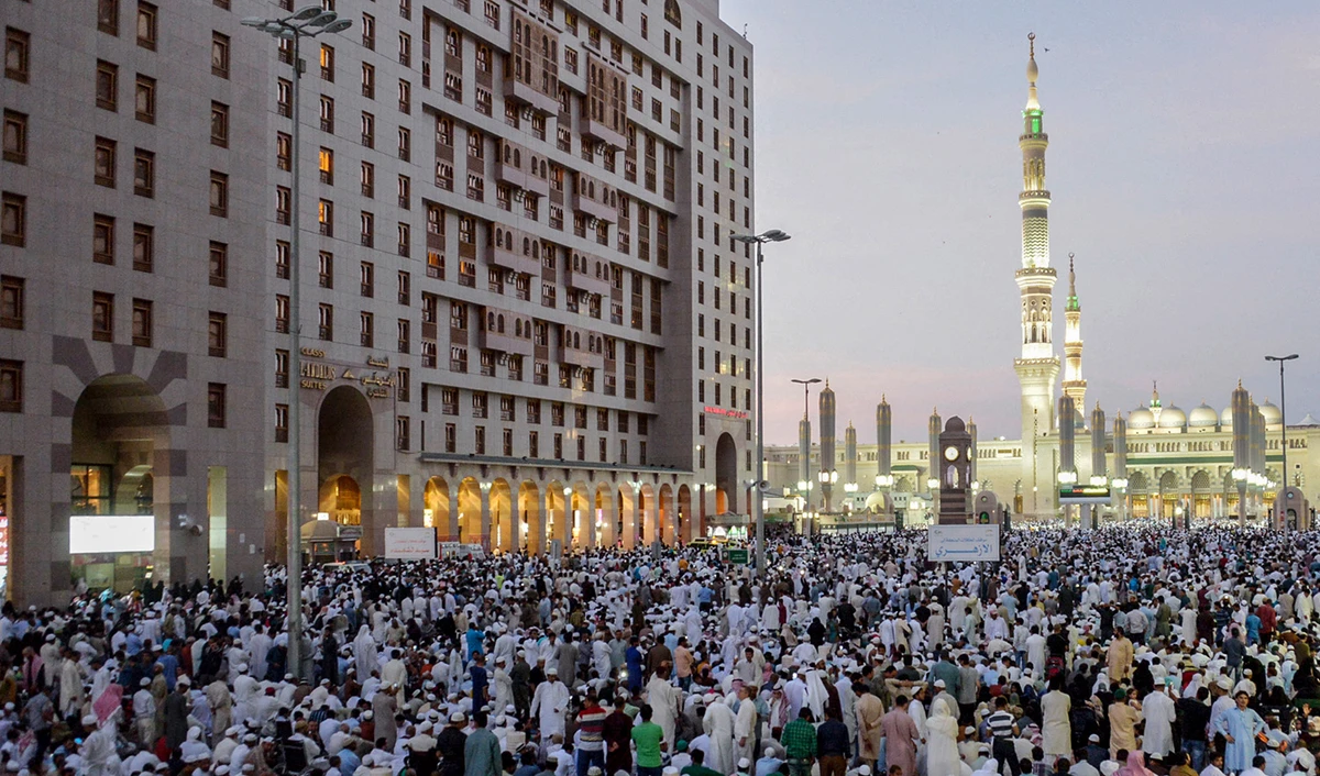Muslim worshippers gather for Eid al-Fitr prayers at Al-Masjid Al-Nabawi in Madinah, Saudi Arabia on July 6, 2016. (AFP/File)