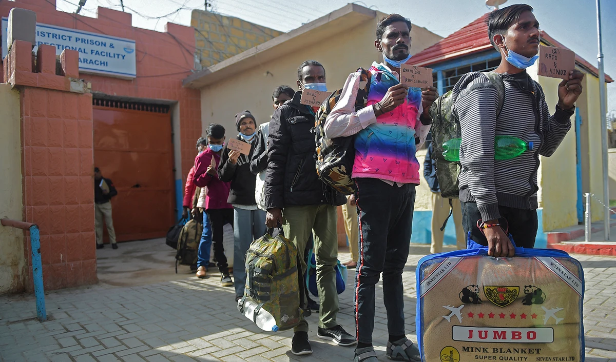 Indian fishermen stand in a queue as they wait to be released after they were imprisoned for fishing in Pakistan territorial waters, in Karachi on January 23, 2022. (AFP/File)