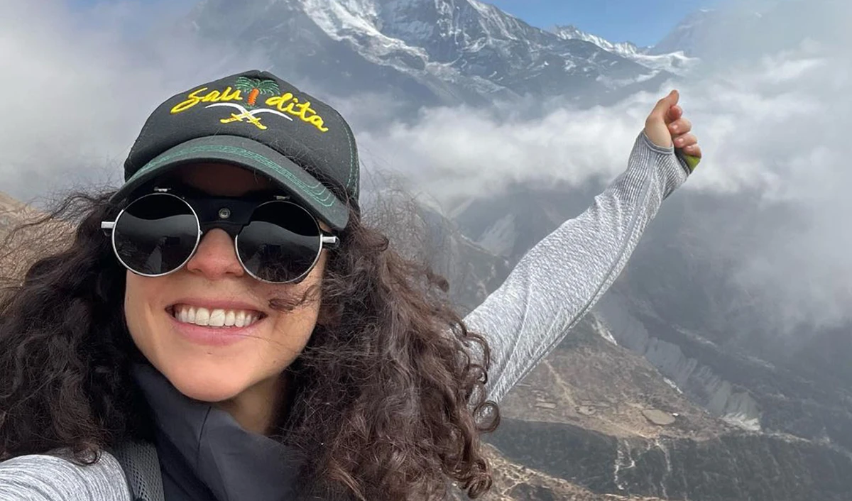 Lebanese mountaineer pose in front of Ama Dablam mountain in Nepal in this file photo shared on her Instagram on November 29, 2021. (Photo courtesy: @nellyattar/Instagram)