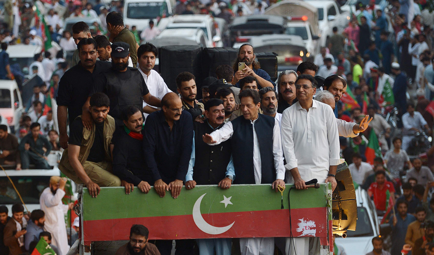Pakistani former prime minister Imran Khan (front 2R) waves to supporters during an anti-government rally in Rawalpindi on July 2, 2022. (AFP)