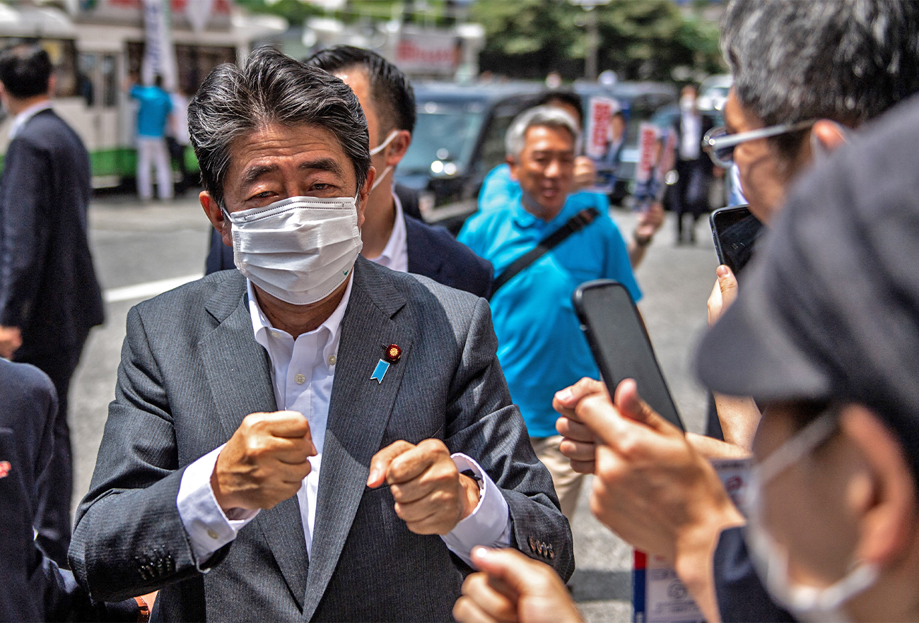 Former Japanese prime minister Shinzo Abe interacts with supporters ahead of the House of Councillors election on July 10, in Tokyo, Japan, on June 22, 2022. (AFP/File)