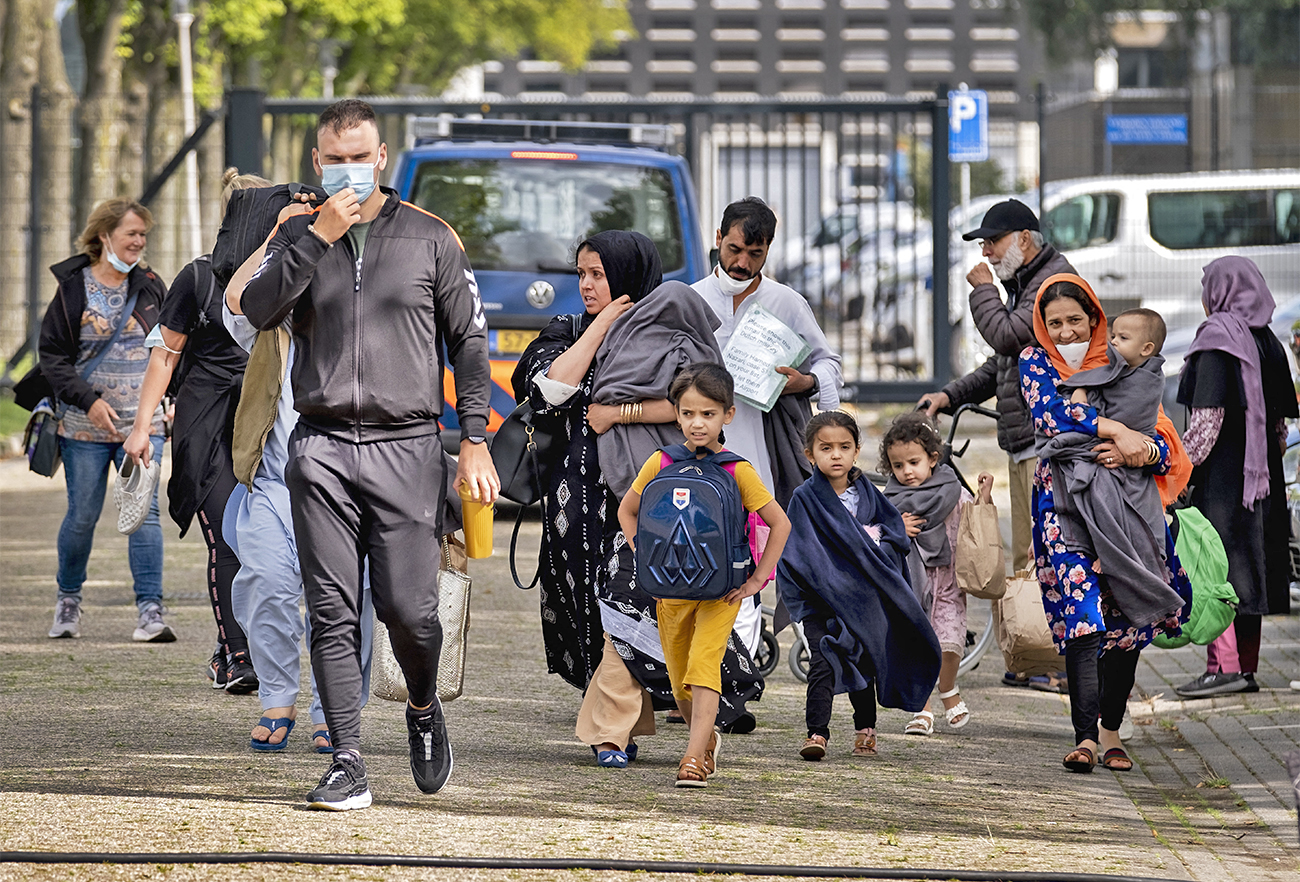 People arrive at the Marine Etablissement Amsterdam in Amsterdam on August 26, 2021, after being evacuated from Afghanistan. (AFP/File)