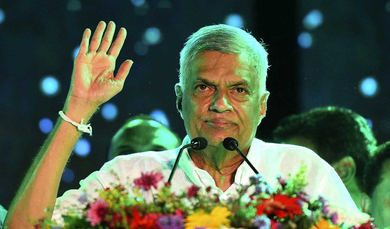 In this file photo taken on August 2, 2020, Sri Lankan leader Ranil Wickremesinghe waves to supporters during a rally ahead of the parliamentary elections in Colombo. (AFP)