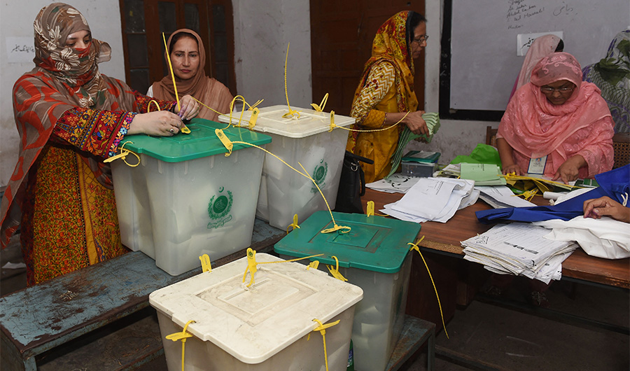 A Pakistani election official seal ballot boxes after after polls closed at a polling station in Lahore on July 25, 2018. (AFP/FILE)