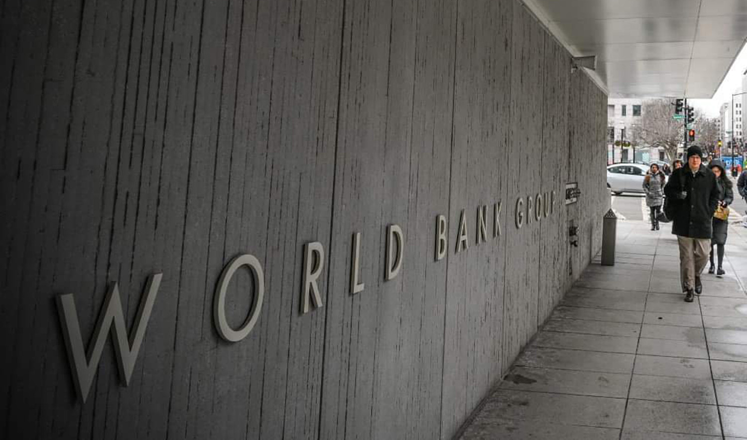A person walks by the building of the Washington-based global development lender, The World Bank Group, in Washington DC, US on January 17, 2019. (AFP/File)