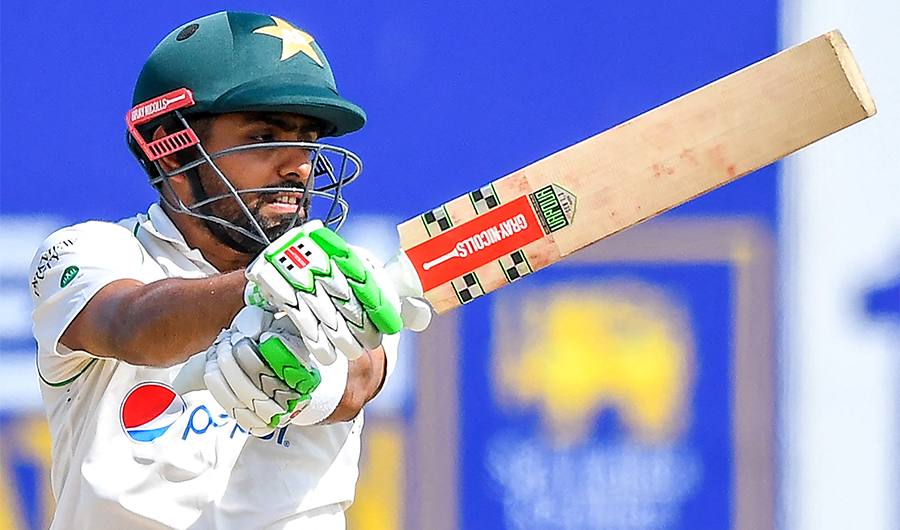 Pakistan's captain Babar Azam plays a shot during the second day of the first cricket Test match between Sri Lanka and Pakistan at the Galle International Cricket Stadium in Galle on July 17, 2022. (AFP)