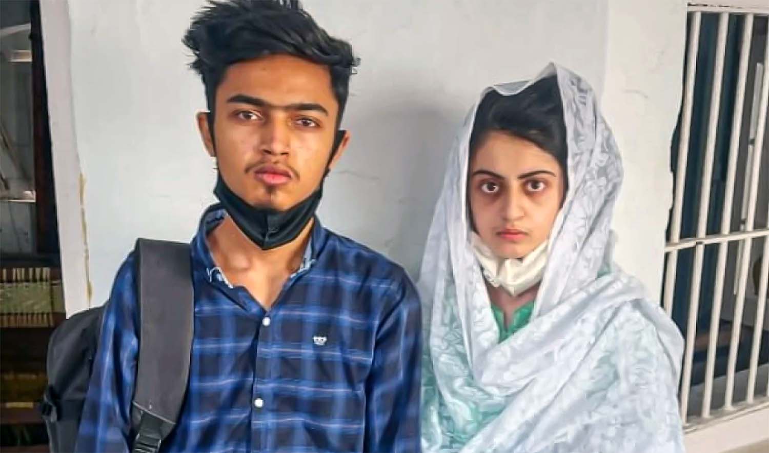 Dua Zehra, right, and her husband Zaheer Ahmed are seen in the custody of the Punjab Police on June 5, 2022. (Photo courtesy: social media/File)