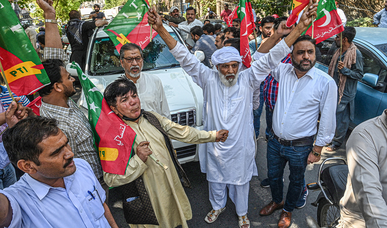 Activists of the Pakistan Tehreek-e-Insaf (PTI) party of ousted prime minister Imran Khan chant slogans during a protest in Lahore on May 24, 2022. (AFP/File)