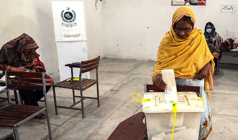 Voters cast their ballot at a polling station during the by-election in Punjab province assembly seat in Lahore on July 17, 2022. (AFP)