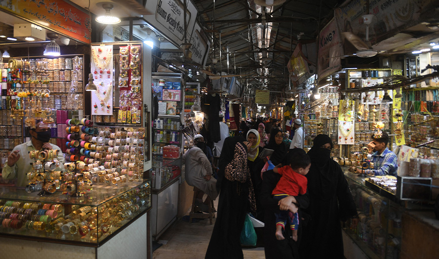 People shop in a market in Karachi on May 11, 2020. (AFP/FILE)