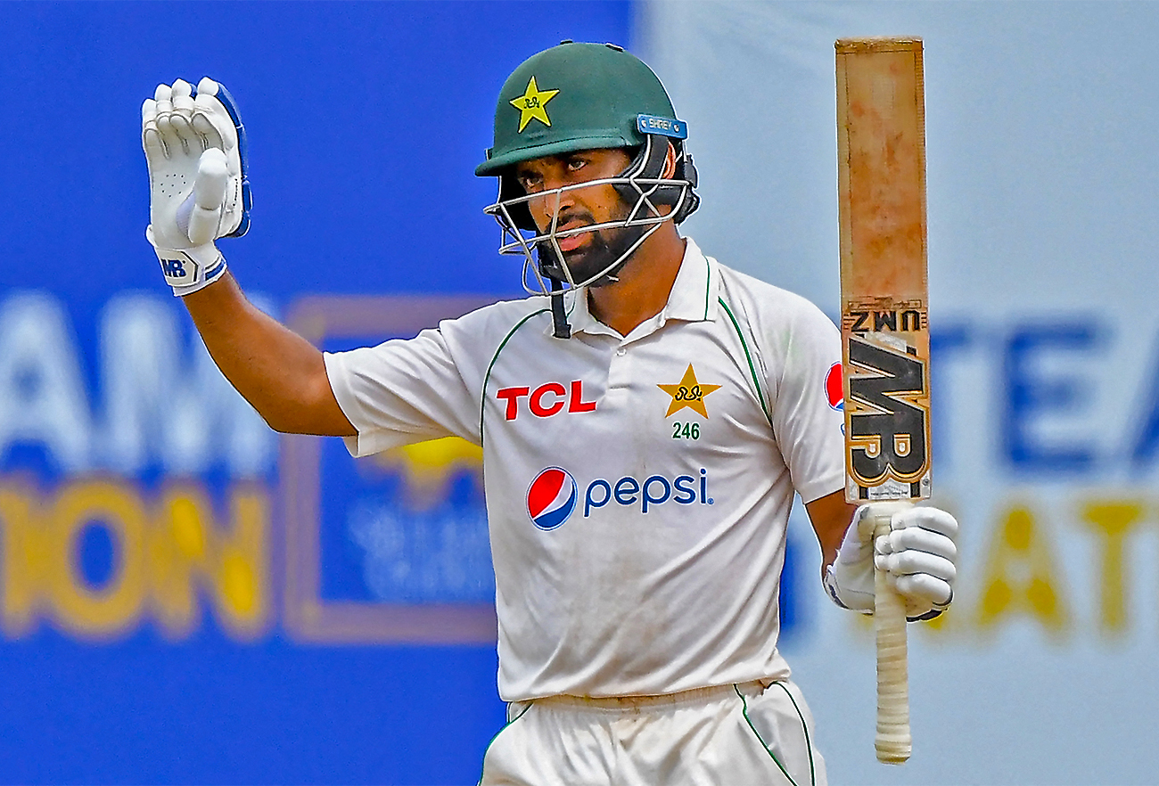 Pakistan’s Abdullah Shafique celebrates after scoring 150 runs during the final day of play of the first cricket Test match against Sri Lanka in Galle on July 20, 2022. (AFP)
