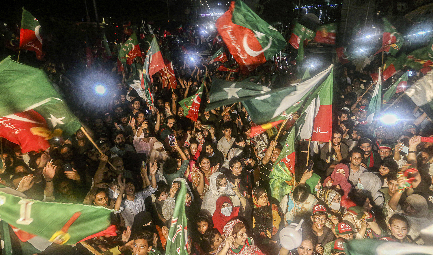 Supporters of former Pakistani Prime Minister Imran Khan's party chant slogans as they protest against Punjab assembly's deputy speaker for his ruling to invalidate 10 votes in the chief minister elections, in Karachi, Pakistan, on July 22, 2022. (AP)