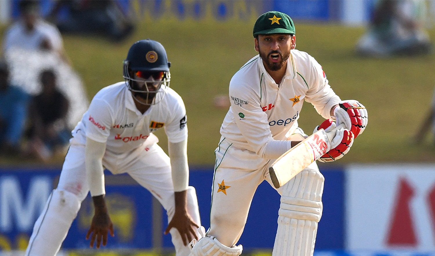 Pakistan's Agha Salman watches the ball after playing a shot during the second day of the second cricket Test match in Galle on July 25, 2022. (AFP)