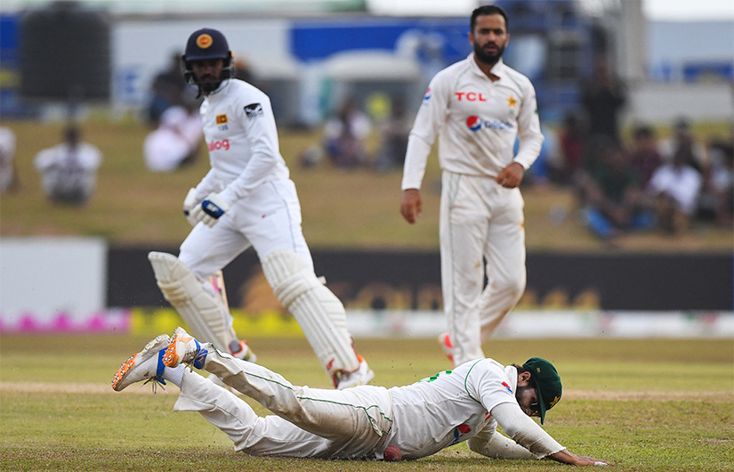 Pakistan's Imam-ul-Haq (C) fields a ball during the third day of play of the second cricket Test match between Sri Lanka and Pakistan at the Galle International Cricket Stadium in Galle on July 26, 2022. (AFP)