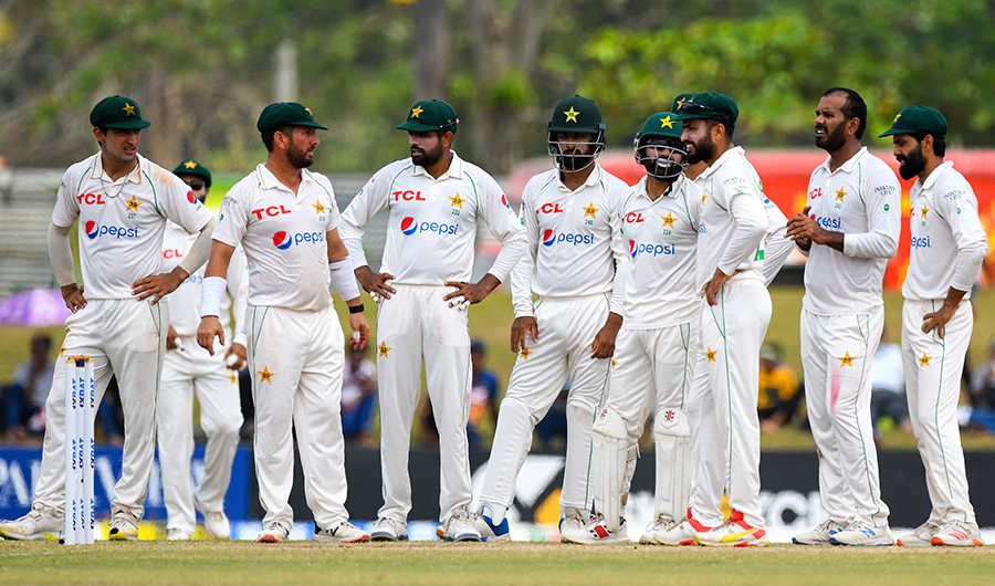 Pakistan's players wait for the third umpire's decision during the fourth day of the second cricket Test match between Sri Lanka and Pakistan in Galle on July 27, 2022. (AFP)