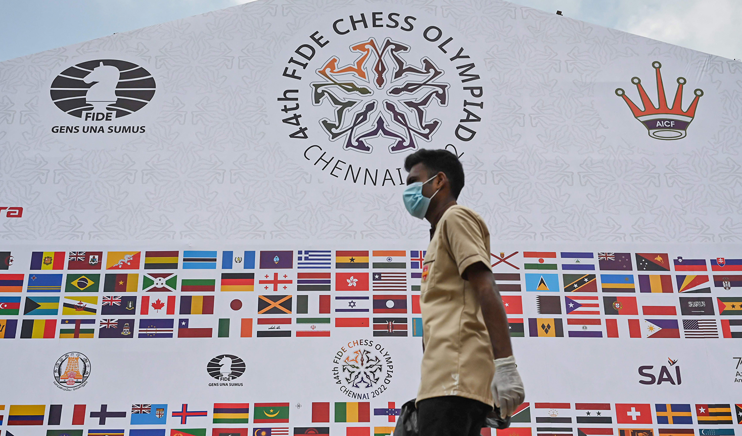 A worker walks past a tent at the 44th Chess Olympiad 2022, in Mahabalipuram, India, on July 27, 2022. (AFP)