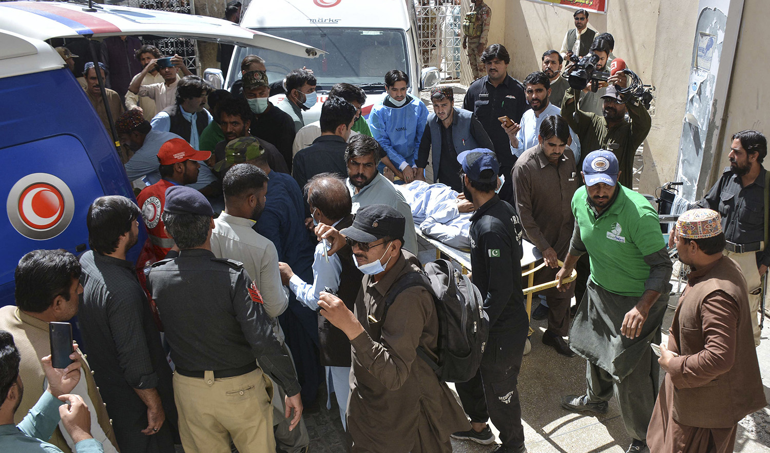 Volunteers move starchers carrying injured victims to a hospital following an earthquake in Pakistan's Balochistan province on October 7, 2021. (AFP/File)