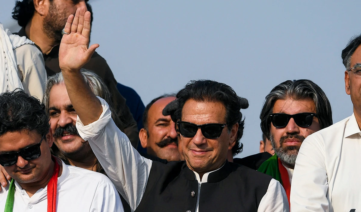 Ousted Pakistan's prime minister Imran Khan, center, waves at his party supporters during a rally in Islamabad on May 26, 2022. (AFP/File)