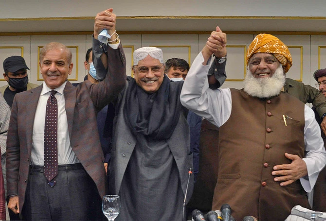 Pakistani opposition leaders, Shahbaz Sharif (L), Asif Ali Zardari (C), former President and leader of Pakistan Peoples Party, and Fazlur Rehman (R), head of JUI-F, gesture during a press conference in Islamabad on March 8, 2022. (AFP)