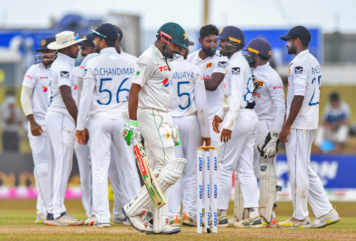 Pakistan’s Babar Azam (foreground C) walks back to the pavilion after his dismissal during the final day of the second cricket Test match between Sri Lanka and Pakistan in Galle on July 28, 2022. (AFP)