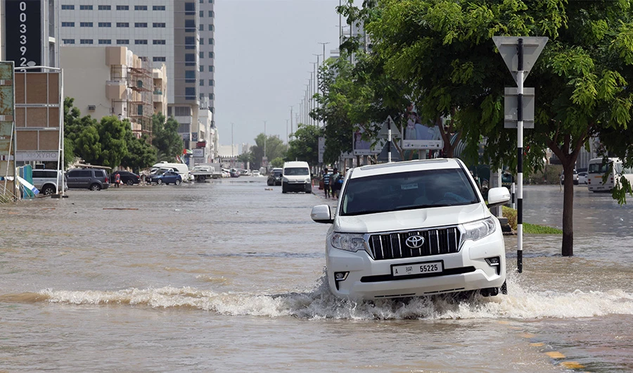 A flooded street is pictured in the UAE's Fujairah emirate following heavy rainfall on July 29, 2022..(AFP)