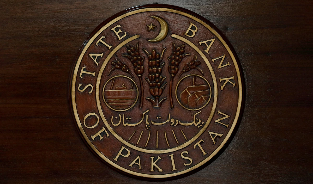 The logo of the State Bank of Pakistan (SBP) is pictured on a reception desk at the head office in Karachi, Pakistan, on July 16, 2019. (REUTERS/File)