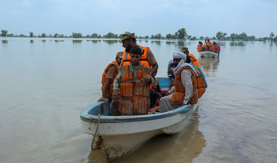 Soldiers of Pakistan army rescue people from the flood affected Rajanpur district, in the Punjab province of Pakistan, on August 2, 2022. (AFP)